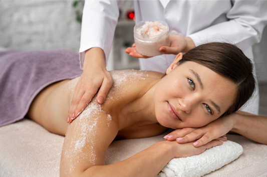 Girl getting massage with body scrub